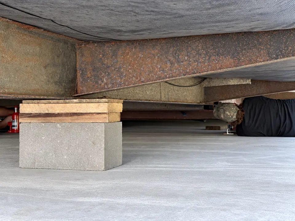 Support blocks and shims beneath the home